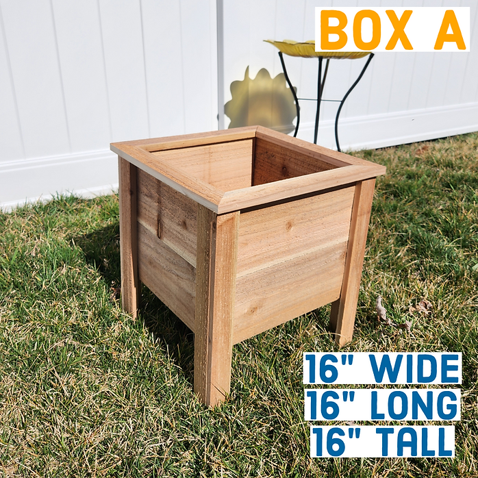 Wooden planter box on grass with dimensions displayed