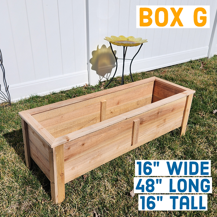 Wooden planter box on grass with dimensions displayed