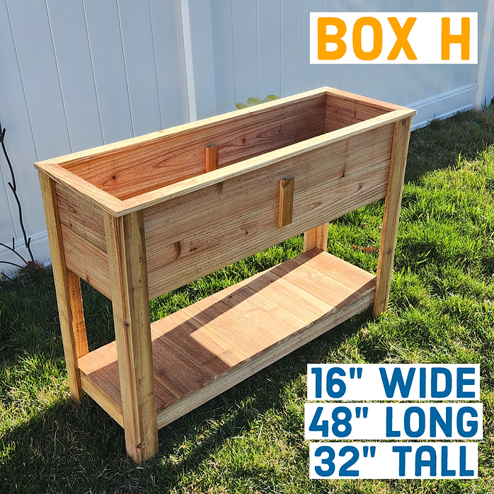 Wooden planter box with dimensions labeled on a grassy area.