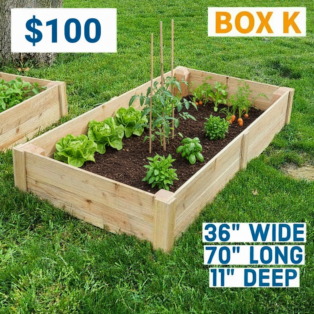 Wooden raised garden bed on grass with dimensions displayed