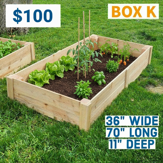 Wooden raised garden bed on grass with dimensions displayed