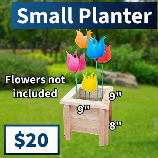 Small wooden planter with colorful plastic flowers on a grassy background