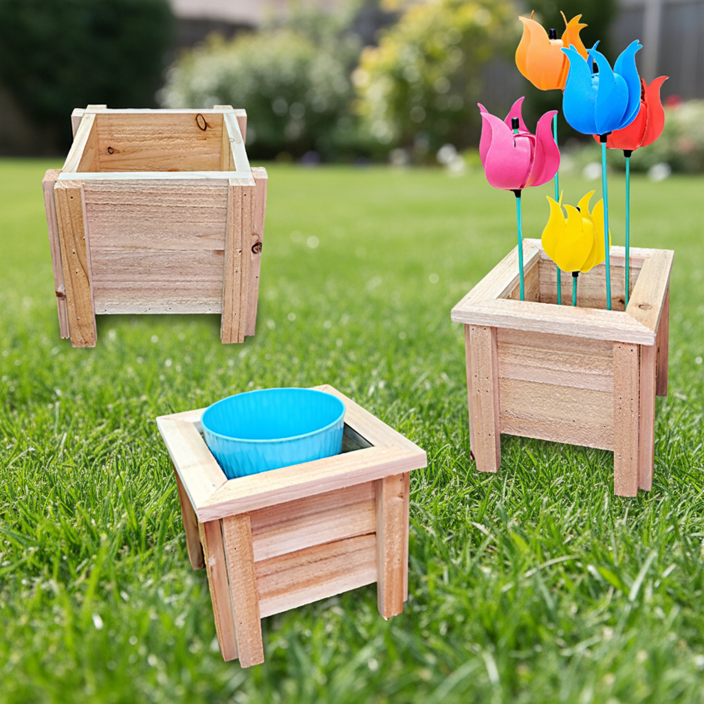 Wooden planters with colorful plastic flowers on a grassy background